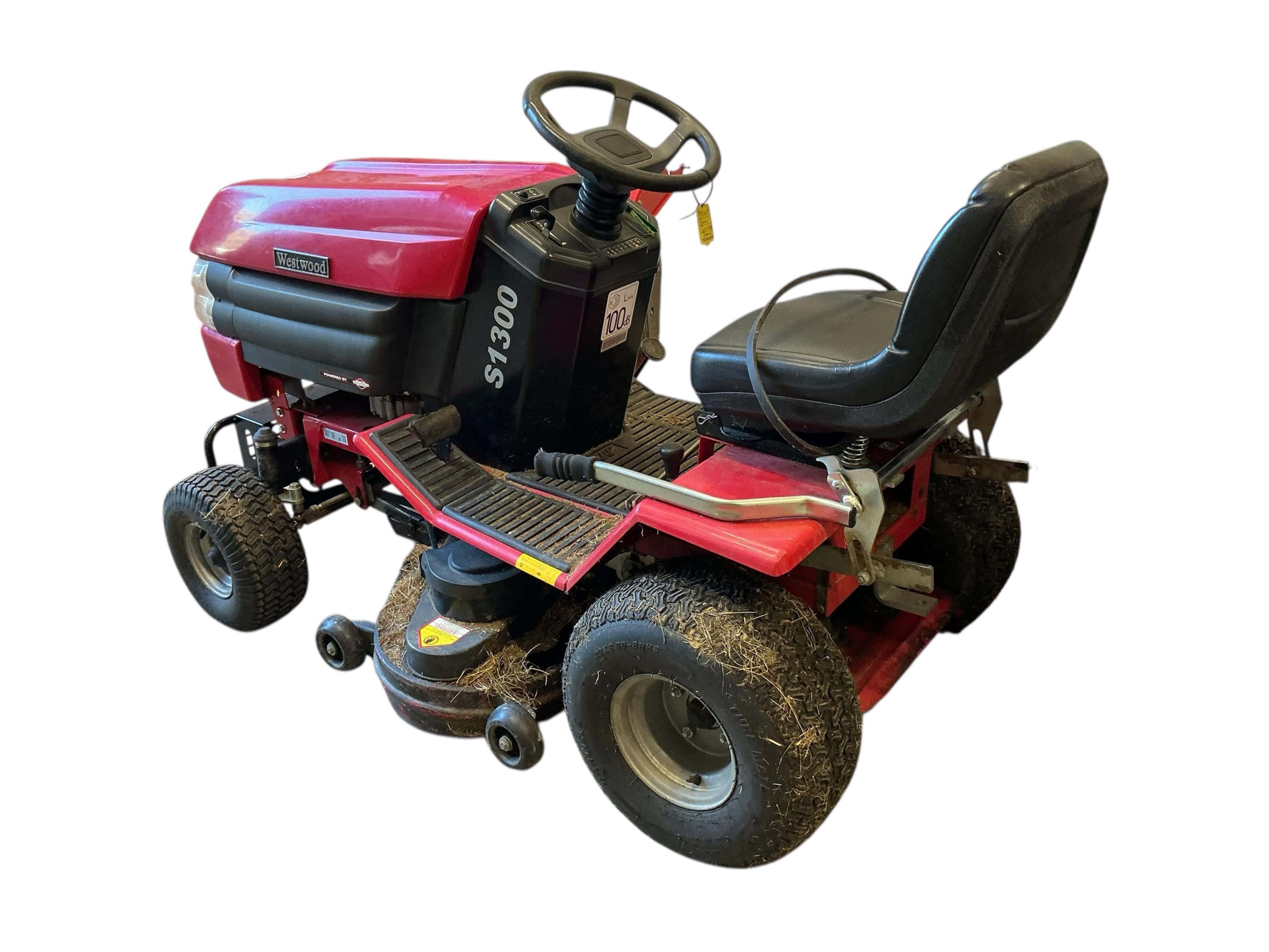 A Westwood S1300 ride on mower with scarifier and brass box attachments